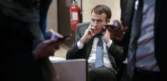 French Economy and Industry Minister Emmanuel Macron gives a phone call prior to a hearing at the French Parliament in Paris on March 11, 2015 related to US group General Electric's planned 12.4-billion-euro ($14.1-billion) acquisition of the energy business of its French rival Alstom. 
                            AFP PHOTO/JACQUES DEMARTHON (Photo by JACQUES DEMARTHON / AFP)