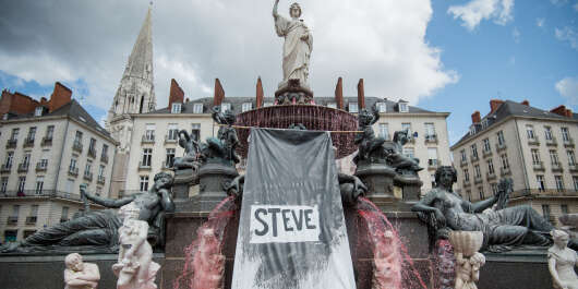 A red dye had been displayed in the fountain of the Place Royale on July 30, 2019 in the western French city of Nantes, a day after the body of Steve Maia Canico, a 24-year-old French man who disappeared a month ago after falling in the river following a police operation during a music festival, had been found in the Loire river. - French investigators have confirmed the identity of a 24-year-old man whose body was found in a river more than a month after a controversial intervention by riot police at a music festival, a legal source told AFP on July 30, 2019. Steve Canico went missing on the night of June 21-22 after officers moved in to disperse techno music fans in the western city of Nantes, who were attending a free concert as part of France's national music celebration day. (Photo by LOIC VENANCE / AFP)