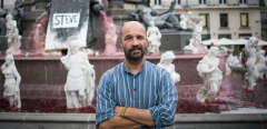 Eric Sagot, one of the men who organised a red dye operation, in the fountain of the Place Royale and black armbands on statues of "Reconstituer" artwork by French artist Stephane Vigny presented during the "Voyage a Nantes" art festival, in the western French city of Nantes poses for a photo session on July 30, 2019 a day after the body of Steve Maia Canico, a 24-year-old French man who disappeared a month ago after falling in the river following a police operation during a music festival, had been found in the Loire river. - French investigators have confirmed the identity of a 24-year-old man whose body was found in a river more than a month after a controversial intervention by riot police at a music festival, a legal source told AFP on July 30, 2019. Steve Canico went missing on the night of June 21-22 after officers moved in to disperse techno music fans in the western city of Nantes, who were attending a free concert as part of France's national music celebration day. (Photo by LOIC VENANCE / AFP) / RESTRICTED TO EDITORIAL USE - MANDATORY MENTION OF THE ARTIST UPON PUBLICATION - TO ILLUSTRATE THE EVENT AS SPECIFIED IN THE CAPTION