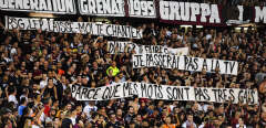 Metz' supporters hold banners during the French L1 football match between Metz (FCM) and Paris (PSG) at the Saint Symphorien stadium in Longeville-les-Metz, eastern France, on August 30, 2019. - The match was halted by referee during several minutes after supporters brandished a homophobic banner. (Photo by JEAN-CHRISTOPHE VERHAEGEN / AFP)