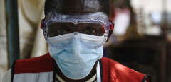 A health worker wears protective gears at the Mpondwe Health Screening Facility in the Uganda border town with the Democratic Republic of Congo, on June 13, 2019. - A grandmother in Uganda has died from Ebola, health officials said on June 12, 2019, the second fatality in the country since a major outbreak in Democratic Republic of Congo crossed the border. (Photo by ISAAC KASAMANI / AFP)