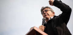 French member of Parliament and president of the leftist La France Insoumise (LFI) party Jean-Luc Melenchon addresses people gathered in Paris on October 12, 2019 in a demonstration to support Kurdish militants and protest as Turkey kept up its assault on Kurdish-held border towns in northeastern Syria, on the fourth day of an offensive that is drawing growing international condemnation, even from Washington. (Photo by Martin BUREAU / AFP)