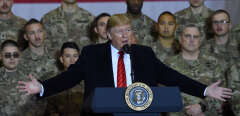 US President Donald Trump speaks to the troops during a surprise Thanksgiving day visit at Bagram Air Field, on November 28, 2019 in Afghanistan. (Photo by Olivier Douliery / AFP)