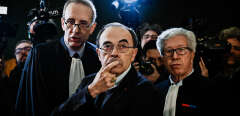 (FILES) In this file photo taken on January 07, 2019, Lyon archbishop, cardinal Philippe Barbarin (C) flanked by lawyers, gestures as he arrives in Lyon court to attend his trial, charged with failing to report a priest who abused boy scouts in the 1980s and 90s. - The decision in the appeal trial of Cardinal Barbarin, who is charged with failing to report a priest who abused boy scouts in the 1980s and 90s, will be delivered in Lyon on January 30, 2020. (Photo by JEFF PACHOUD / AFP)