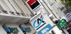 Logos of French banks Societe Generale, Credit Agricole and BNP Paribas on agencies' frontdoors are pictured on September 12, 2011 in Rennes, western France. The French stock market plunged by 4.27 percent in early trading on Monday, and shares in BNP Paribas, Credit Agricole and Societe Generale banks were down by about 10.0 percent.
  AFP PHOTO / DAMIEN MEYER (Photo by DAMIEN MEYER / AFP)