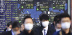 An electric board shows the 225-issue Nikkei Stock Average and others falling in Chuo, Tokyo on Feb. 28, 2020, amid the outbreak of a new coronavirus in Japan. ( The Yomiuri Shimbun via AP Images )/YOMIU/20059060709462/JAPAN OUT/2002280245