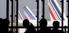 (FILES) In this file photo taken on September 15, 2014 Passengers wait in a lounge as Air France planes are seen behind at Paris-Orly airport in Orly. - The Paris-Orly airport will reopen from June 26, 2020, as part of the second phase of the easing of lockdown measures announced by the French Prime Minister on May 28, 2020 amid the COVID-19 (novel coronavirus) pandemic. (Photo by Kenzo TRIBOUILLARD / AFP)