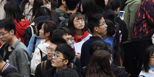 (190412) -- XI'AN, April 12, 2019 (Xinhua) -- Job seekers are seen at a recruitment fair at Shaanxi University of Science and Technology in Xi'an, northwest China's Shaanxi Province, April 12, 2019. More than 200 companies from education, culture, construction and other industries attended the fair, providing nearly 8,000 jobs. Most of the graduates in this job fair come from families with financial difficulties in poverty-stricken areas.