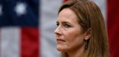 Judge Amy Coney Barrett listens as she is nominated to the US Supreme Court by President Donald Trump in the Rose Garden of the White House in Washington, DC on September 26, 2020. - US President Donald Trump said September 27, 2020 the Senate will "easily" confirm his Supreme Court nominee Amy Coney Barrett before the election, despite furious Democratic opposition to his bid to steer the court rightward for years to come. Trump has nominated Barrett, a darling of conservatives for her religious views, to replace the late liberal justice Ruth Bader Ginsburg in a lifetime seat on the top court, potentially impacting some of the most partisan issues in America, from abortion to gun rights to health care. (Photo by Olivier DOULIERY / AFP)