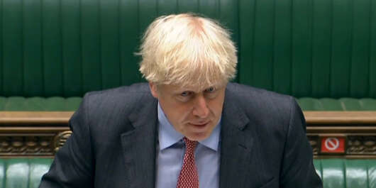 A video grab from footage broadcast by the UK Parliament's Parliamentary Recording Unit (PRU) shows Britain's Prime Minister Boris Johnson standing at the dispatch box and speaking during Prime Minister's Question time (PMQs) in the House of Commons in London on September 30, 2020. (Photo by - / various sources / AFP) / RESTRICTED TO EDITORIAL USE - MANDATORY CREDIT " AFP PHOTO / PRU " - NO USE FOR ENTERTAINMENT, SATIRICAL, MARKETING OR ADVERTISING CAMPAIGNS