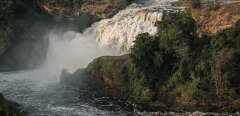 The view of the Uhuru Falls, one of the majestic natural sites in Africa where the government has a plan to build a hydroelectric dam, on the Victoria Nile at Murchison Falls National Park, northwest Uganda, on January 25, 2020. - The government authorised a consortium led by Bonang Power and Energy to conduct a feasibility study on the construction of a 360-megawatt dam on the Uhuru Falls adjacent to the Murchison falls in Murchison National Park which is also the second most visited park in Uganda, after Queen Elizabeth National Park. (Photo by Yasuyoshi CHIBA / AFP)