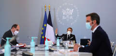 France’s President Emmanuel Macron attends a Defence Council with French Prime Minister Jean Castex (L) and French Health Minister Olivier Veran (R), at the Elysee Palace, in Paris, on November 12, 2020.