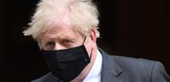 Britain's Prime Minister Boris Johnson, wearing a face mask to combat the spread of the novel coronavirus, leaves 10 Downing Street in central London on April 28, 2021, to take part in the weekly session of Prime Minister's Questions (PMQs) at the House of Commons. - Britain's Electoral Commission on Wednesday announced a formal investigation into how Prime Minister Boris Johnson paid for a lavish makeover of his Downing Street flat, seriously escalating a simmering scandal.