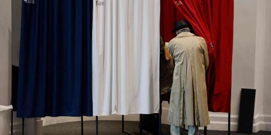 Voters prepare to vote at a polling station in Le Touquet, for the second round of the French regional elections on June 27, 2021. (Photo by Ludovic MARIN / AFP)