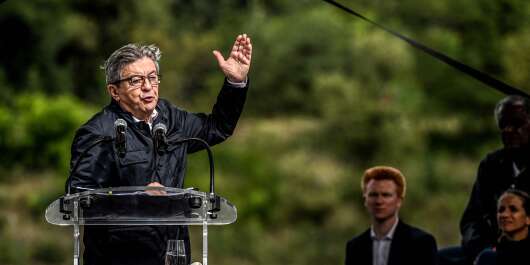 French leftist movement La France Insoumise (LFI) leader Jean-Luc Melenchon gestures as he speaks during a meeting in Chateauneuf-sur-Isere, near Valence on August 29, 2021. (Photo by OLIVIER CHASSIGNOLE / AFP)