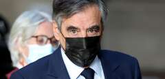 (FILES) In this file photo taken on November 22, 2021 former France's Prime Minister Francois Fillon arrives at the Paris' courthouse for his wife Penelope Fillon's trial on appeal in the case of suspected fictitious employment. - Former Prime Minister Francois Fillon is due to be questioned until november 30, 2021 at his appeal trial in Paris over suspicions that his wife Penelope Fillon may have been employed illegally, a case in which he is trying to reshuffle the deck after a first instance conviction. (Photo by Thomas COEX / AFP)