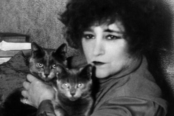 French novelist Colette (Sidonie-Gabrielle Colette, 28 January 1873 – 3 August 1954) with her two cats in 1937 in Paris. Colette ended her days, surrounded by her beloved cats, confined to her Palais-Royal apartment overlooking Paris. AFP PHOTO (Photo by FRANCE PRESSE VOIR / AFP)