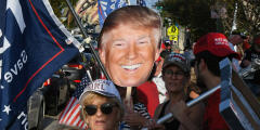 â€‹â€‹â€‹â€‹â€‹â€‹â€‹â€‹â€‹â€‹â€‹â€‹â€‹â€‹WEST PALM BEACH, FLORIDA, UNITED STATES - APRIL 4: Supporters of former U.S. President Donald Trump wave signs and flags as they wait for the motorcade carrying Trump to make its way back to his Mar-a-Lago Club following his arraignment in New York on April 4, 2023 in West Palm Beach, Florida. Paul Hennessy / Anadolu Agency (Photo by Paul Hennessy / ANADOLU AGENCY / Anadolu Agency via AFP)