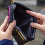 a person looking the wallet