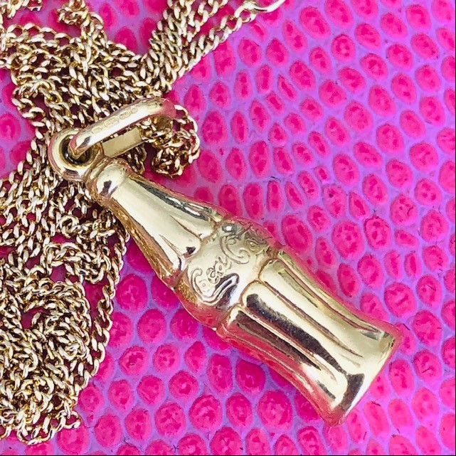 The gold Coke-Cola bottle necklace 