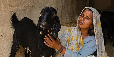 Woman with a GFA World provided goat