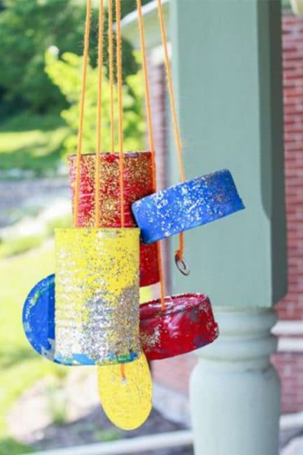 Paint some upcycled tin cans to make a pretty wind chime!