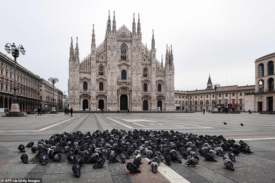 Pigeons are the only large group of visitors on the Piazza del Duomo in Milan this morning, next to the cathedral which had already been closed because of the coronavirus outbreak