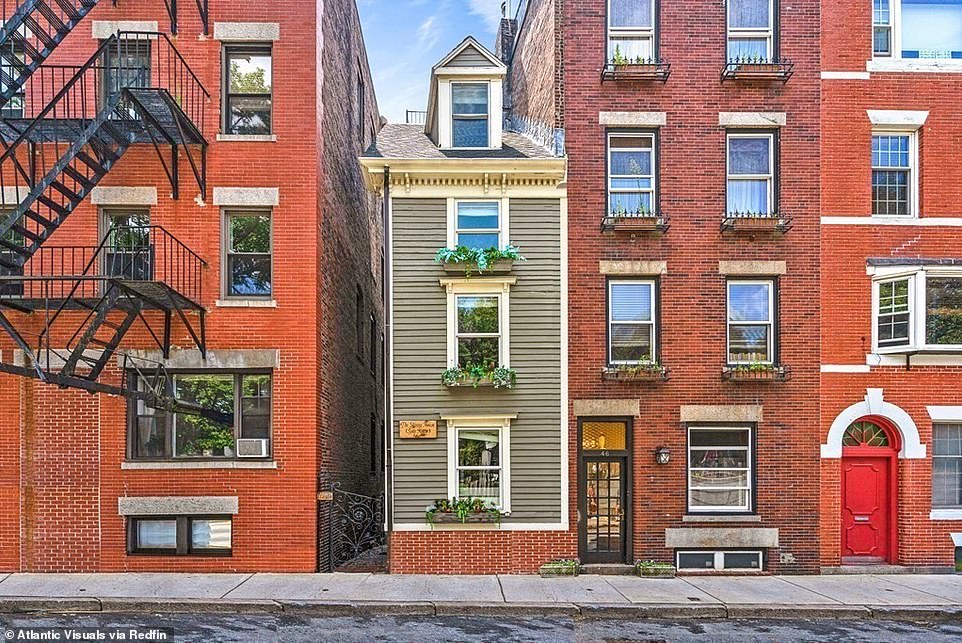 Boston's infamous 'skinny house' in the city's North End sold to a family of four this week for $1.25million after about a month on the market. The single-family home is only ten feet wide and 30 feet long