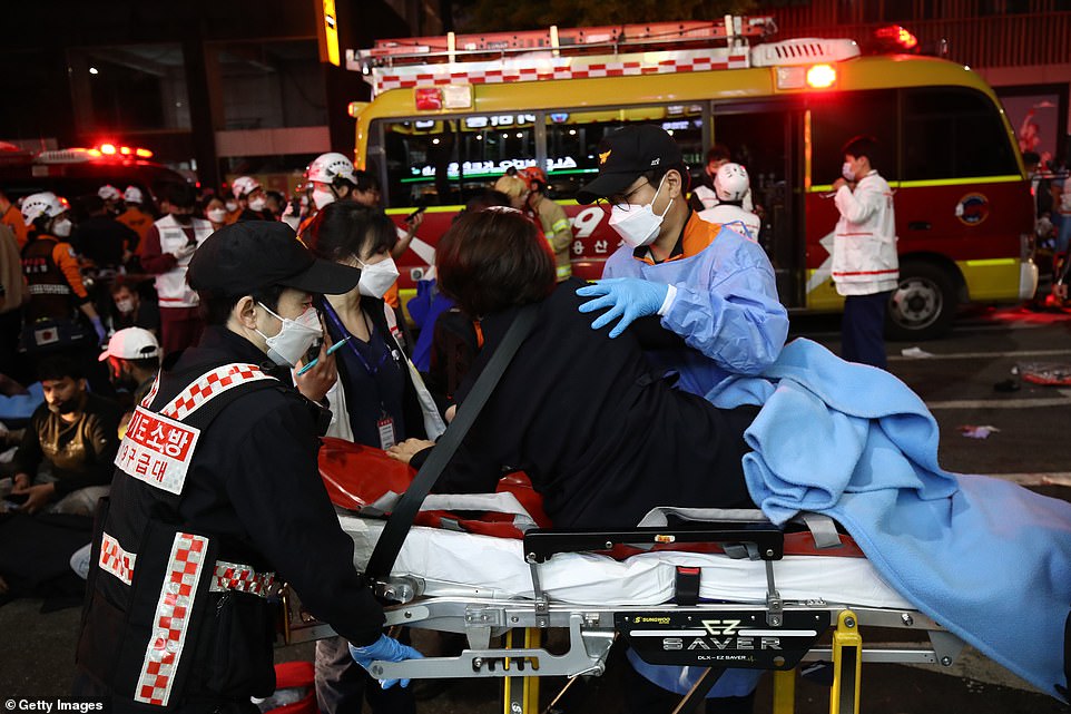 Paramedics treat some of those caught up in the stampede in the minutes after the incident