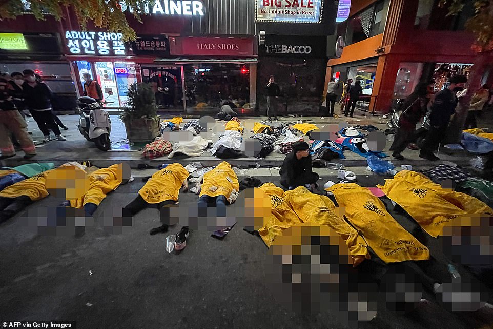 At least 25 bodies appear to be lying on the ground in this image taken from the scene in the aftermath of the incident