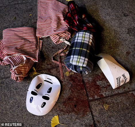 Pools of blood can be seen on Seoul's streets alongside the remnants of Halloween costumes