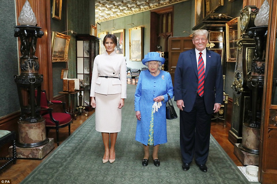Queen Elizabeth II stands with US President Donald Trump and his wife, Melania, in the Grand Corridor during their visit to Windsor Castle 