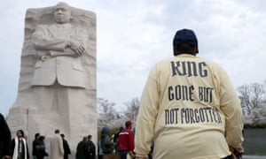 Marchers gather at the Martin Luther King Memorial for a silent walk to a prayer service on the National Mall to mark the 50th anniversary of Kingâ€™s assassination on 4 April 2018 in Washington DC.