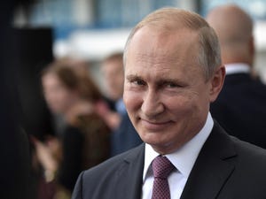 Vladimir Putin grinning