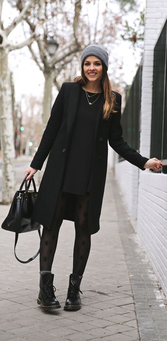 Winter Outfits We’d Wear: Natalia Cabezas is wearing a black dress and coat from Zara, boots from Dr. Martens, bag from Michael Kors and the hat is from Asos
