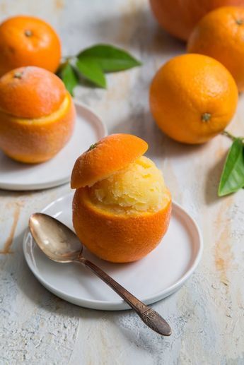 Orange Sorbet served in real oranges. A classic, scrumptious warm weather treat. #citrus #desserts