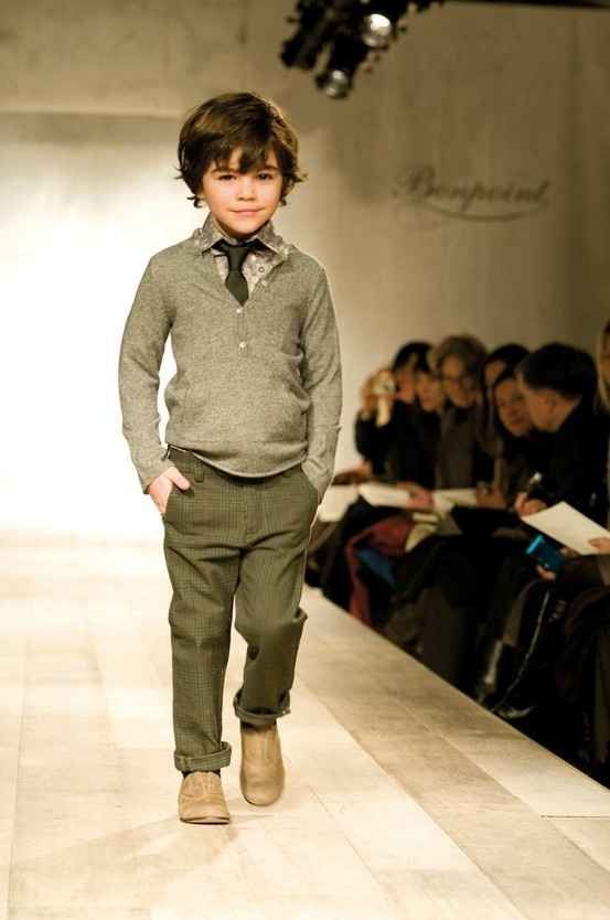 That is the sly smile of someone who will one day run the world. But for now he must run this catwalk. | 25 Kids Too Trendy For Their Own Good