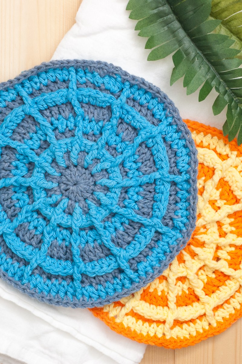 Orange and blue circular crocheted potholders