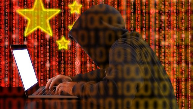 Arty picture of Chinese hacker, using binary code to make up image.
