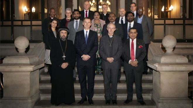 Foreign Secretary Jeremy Hunt (front row, second left), the Archbishop of Canterbury Justin Welby (front row, second right) are joined by other Christian leaders including Archbishop Angaelos of the Coptic Orthodox Church of Britain (left), and dignitaries and politicians with survivors of Christian persecution
