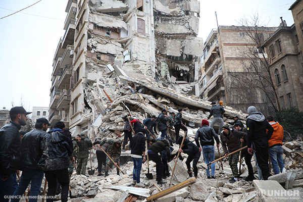 Rescuers in search of earthquake survivors under rubble.