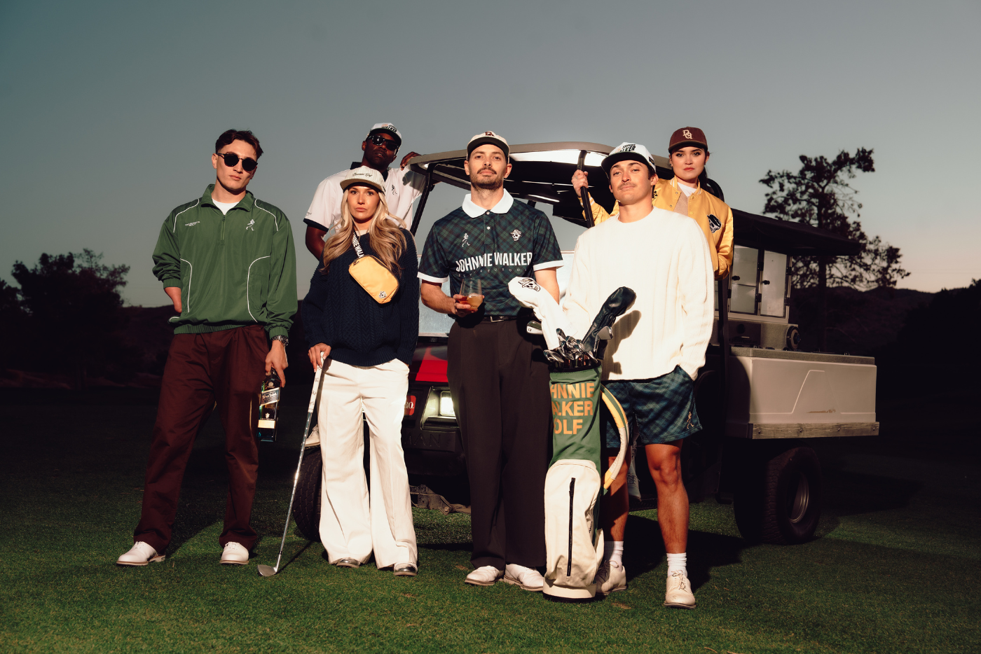 Johnnie Walker Golf Crew in front of golf cart