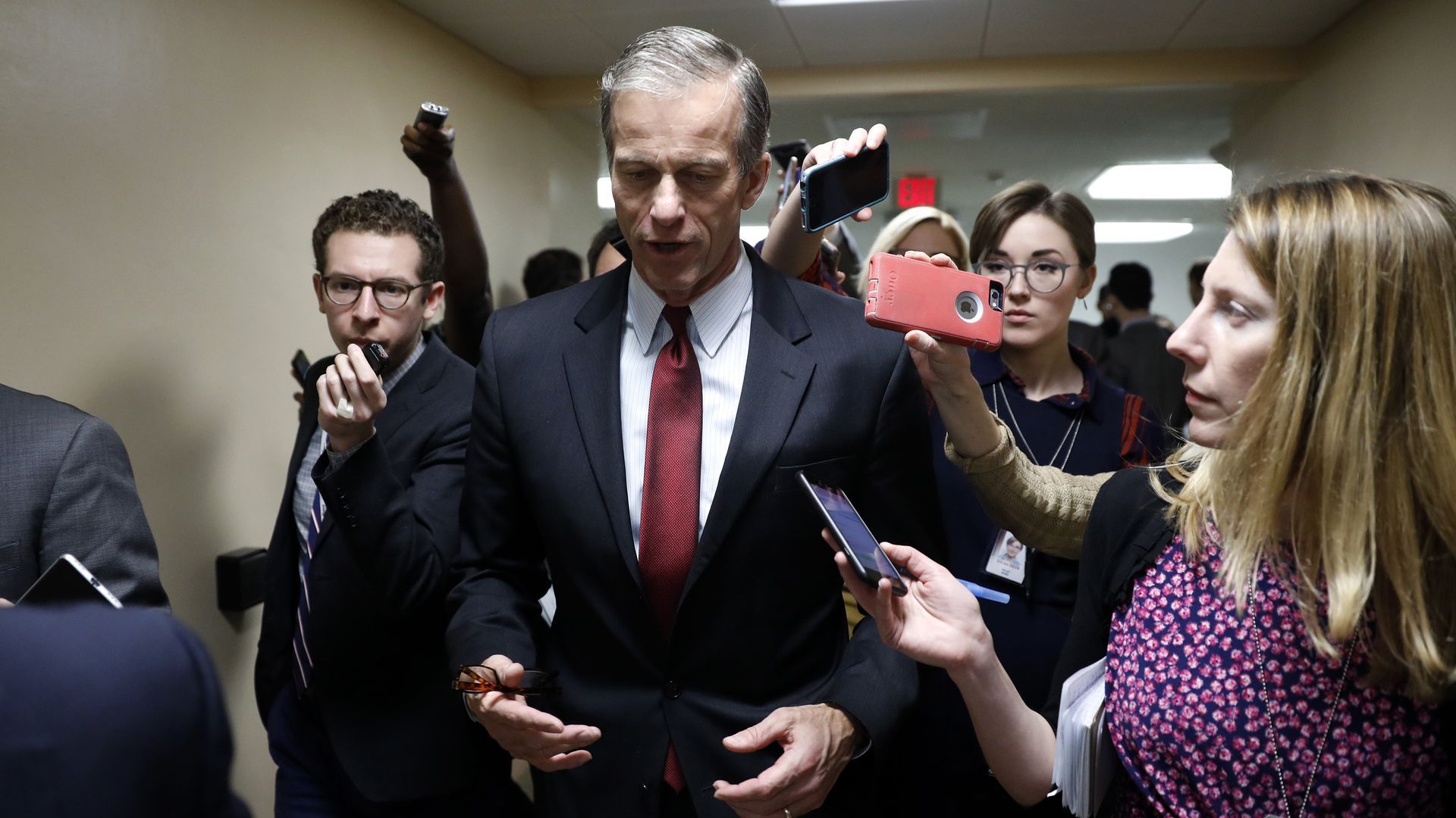 Sen. John Thune seen with a pack of reporters
