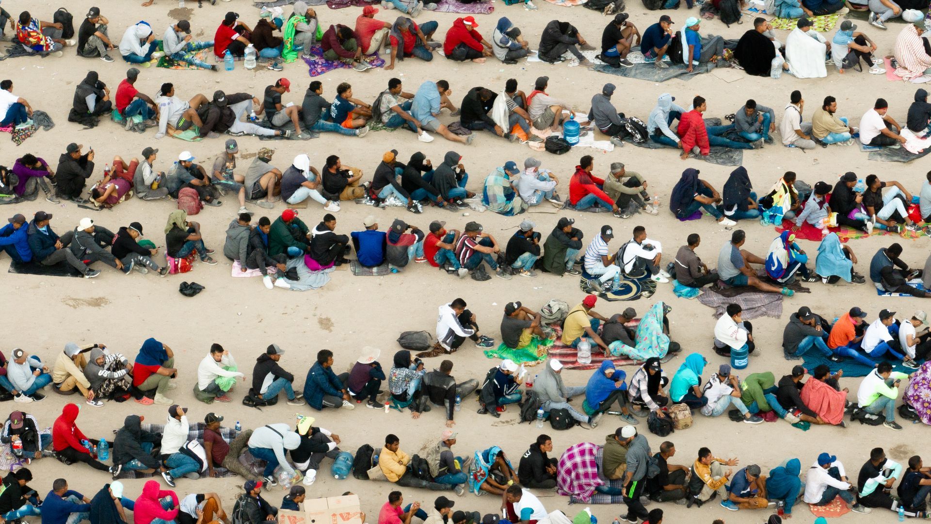 Migrants sitting at the border