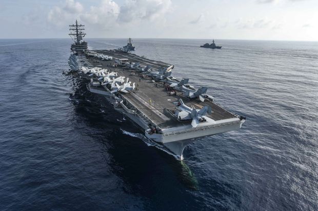 Navy aircraft carrier USS Ronald Reagan
                  conducting an exercise in the South China Sea in
                  August. 