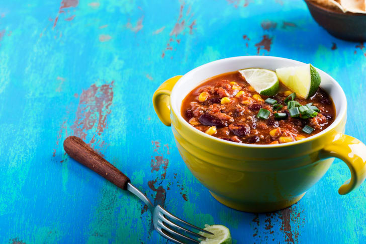 bowl of chili on a blue table