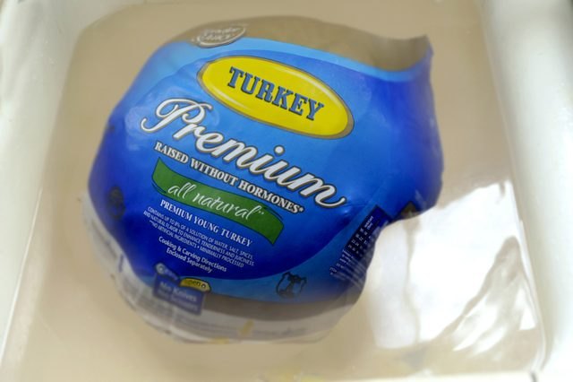 Defrosting the turkey completely is important to ensure even cooking.