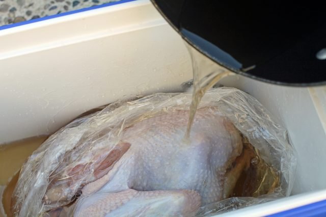 Keeping the turkey in an ice chest keeps the environment insulated for even brining.