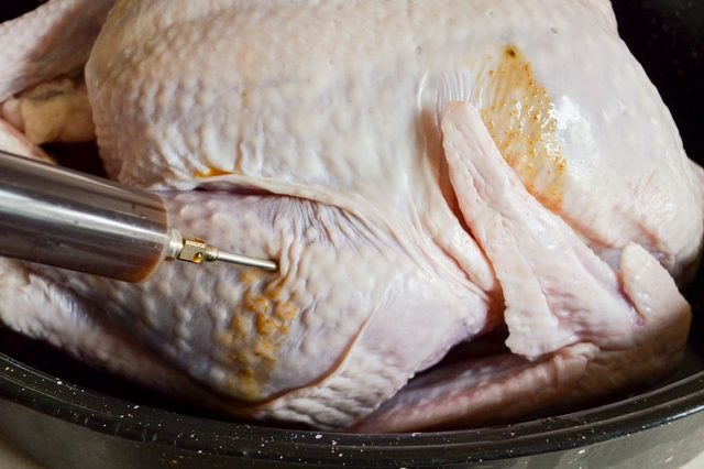 Keep the turkey meat moist and flavorful by injecting a marinade into the meat.