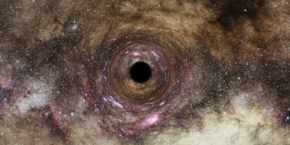 1. La gravedad que dobla la luz revela uno de los mayores agujeros negros